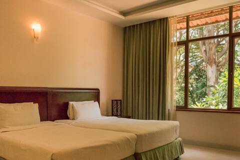 Twin beds at Silent Shores Resort & Spa, Mysore - The best luxury spa resort in mysore for family & couples