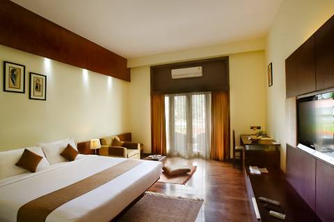 Deluxe suite with big bed - deluxe rooms near me - Silent Shore resort & spa - 5 star resort in Mysore